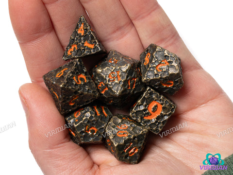 Forbidden World V2 | Cratered Design | Bronze, Brown Distressed Asteroid-Style, Red-Orange Ink | Metal Dice Set (7)