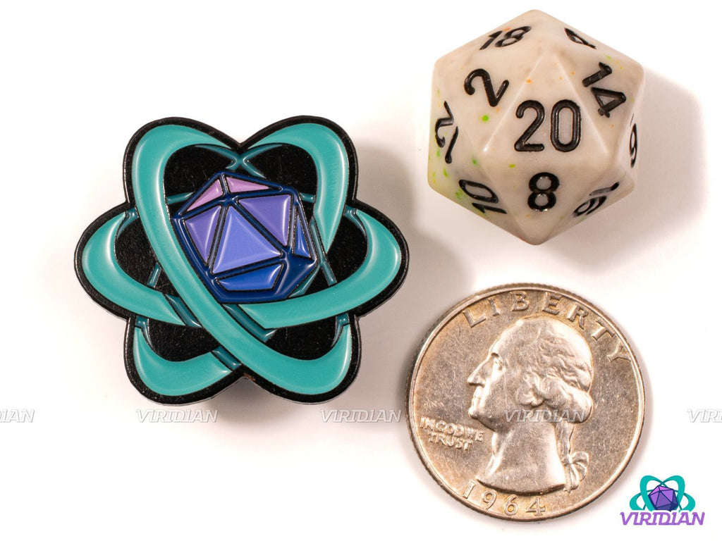 Pin Pals: Viridian Atom Logo enamel pin shown next to a D20 die and a US quarter for scale, perfect for D&D and fantasy accessory collectors.