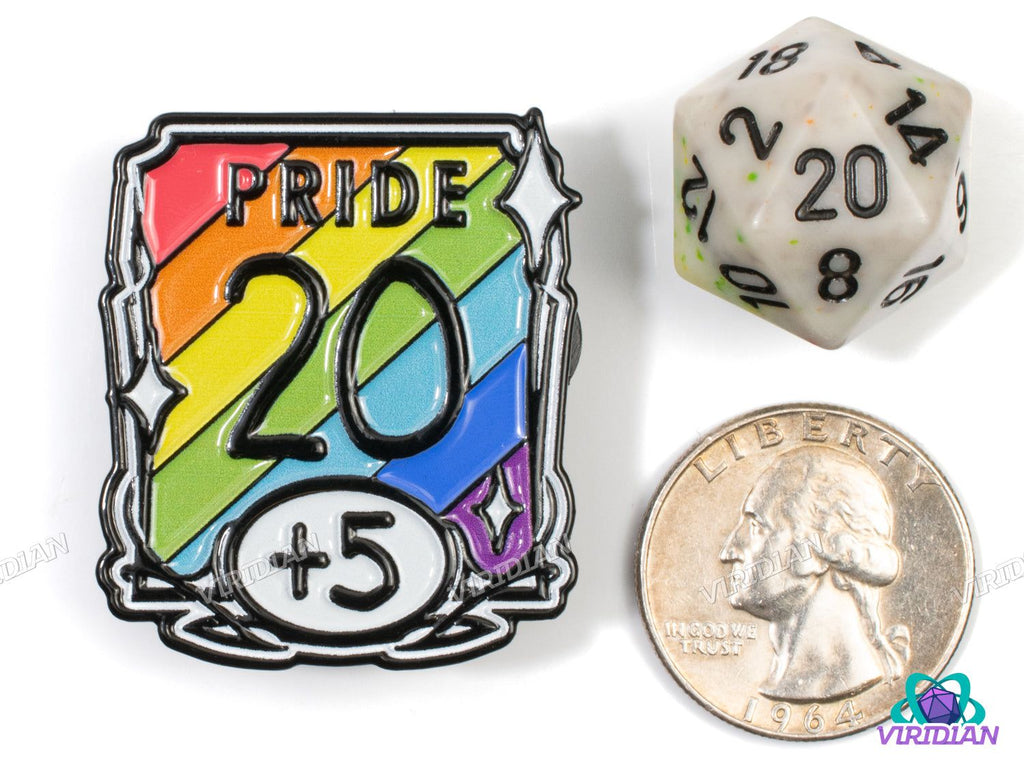 'PRIDE 20 +5' enamel pin shown next to a D20 die and US quarter for size comparison, great for D&D and LGBTQIA pride accessories.