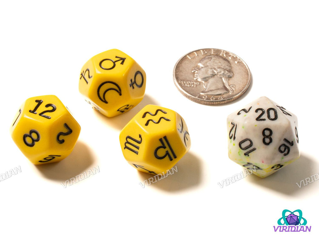 Astrology Dice (Signs, Planets, Numbers) Yellow set shown with a quarter for scale, includes three yellow d12 dice and one white d20 die.
