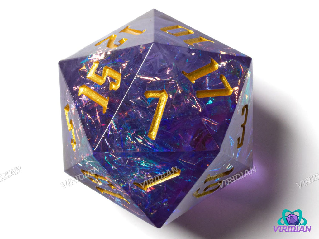 Mistwalker (Large D20) translucent resin die with gold inked numbers, featuring blue and purple holographic film interior, 33mm size.