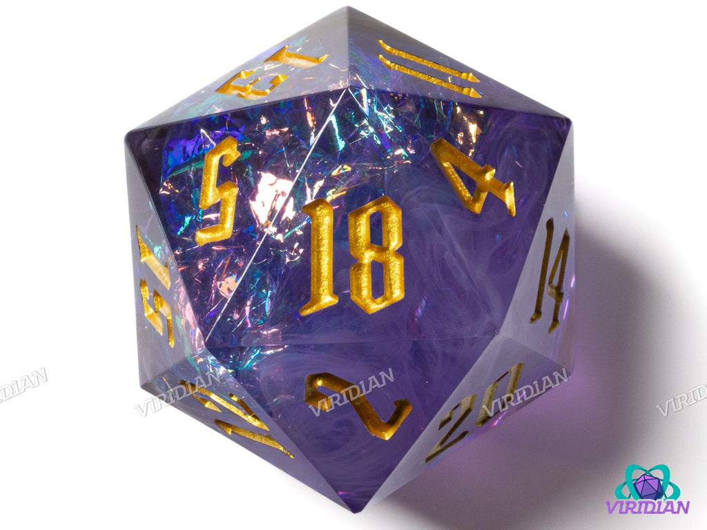 Close-up of Mistwalker (Large D20) giant resin die in purple and blue hues with shimmering holographic film and bold gold numbering.