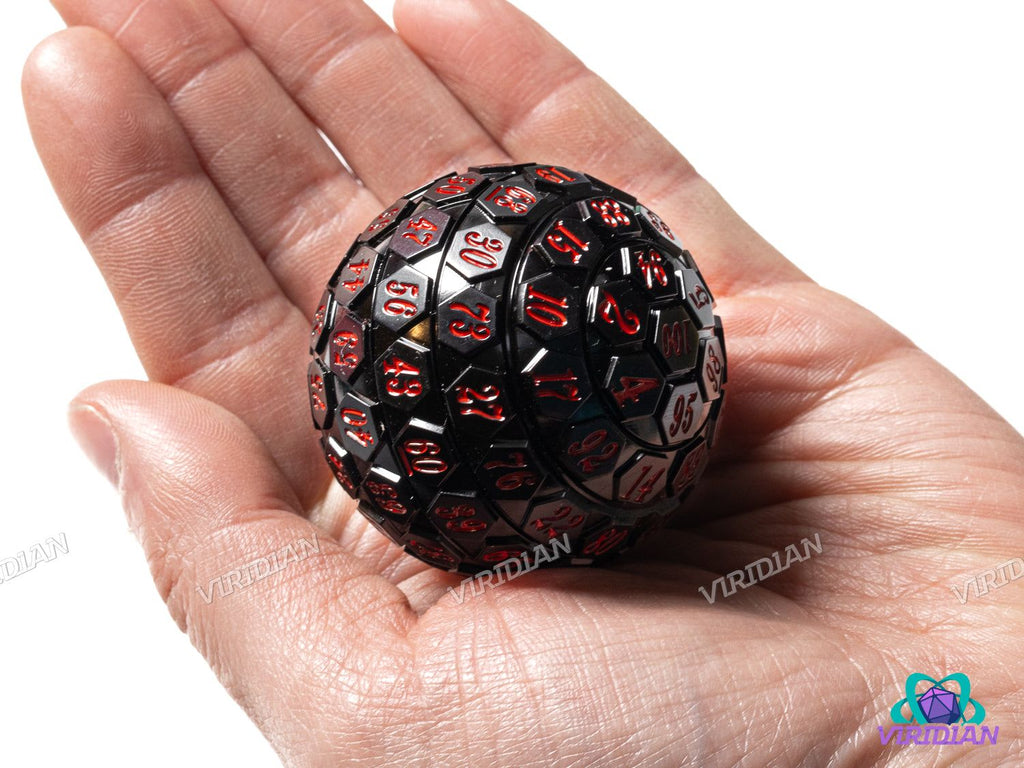 Black & Red D100 giant acrylic die with red numbering displayed in a person's hand, highlighting its large 45mm size and detailed design.