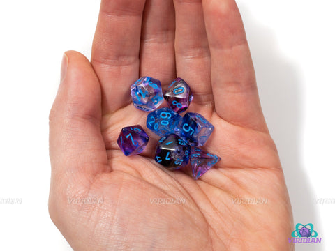 Mini Nebula Nocturnal & Blue | Purple, Swirls, Glow in the dark, 10mm Acrylic Dice Set (7) | Chessex